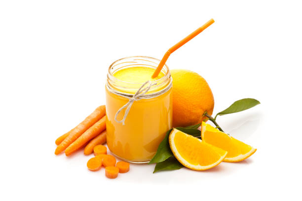 istock Glass jar with orange and carrot juice 695164186