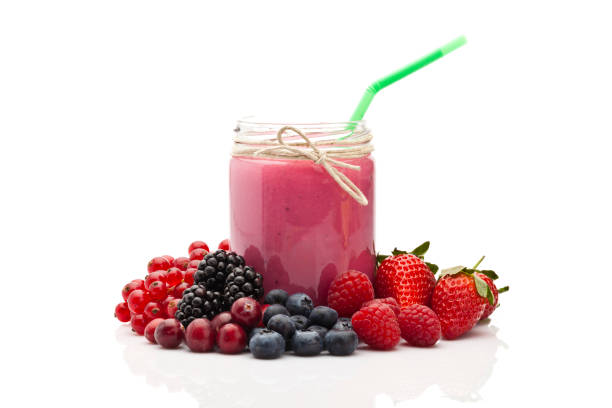 berries smoothie in a glass jar - fruit front view isolated berry fruit imagens e fotografias de stock