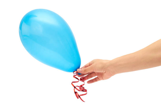 istock Female hand holds single blue party balloon. isolated on white background 695167534
