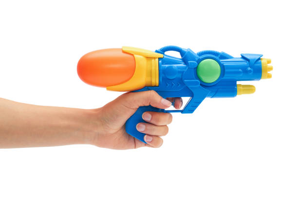 istock Female hand holds blue squirt gun. Isolated on white background 695167556