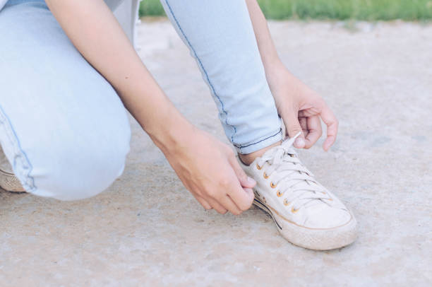 istock Women are tying a shoelace. 695171668