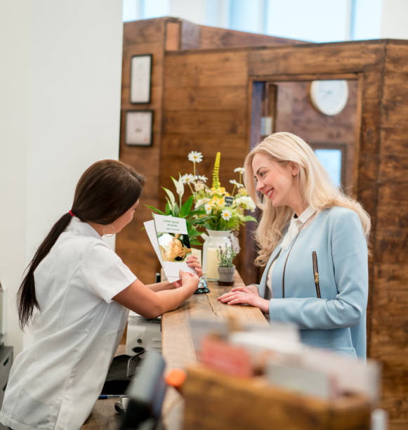 istock Customer talking to the manager at the spa 695177096