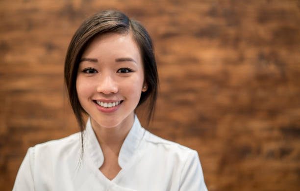 istock Happy Asian masseuse working at a spa 695177152