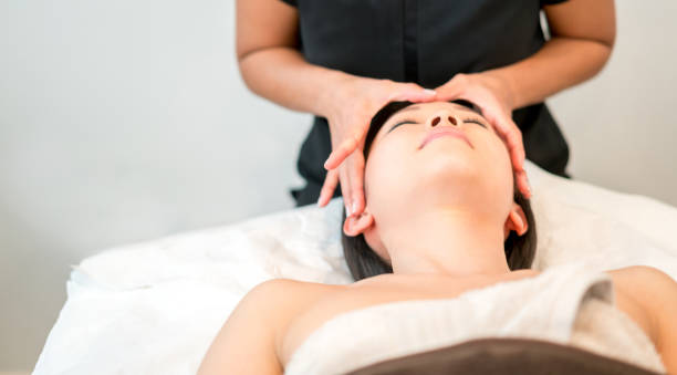 istock Asian woman getting a face massage at the spa 695177270