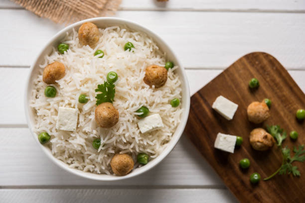 authentic paneer or soya bean or green peas pulav or vegetables rice or veg biryani with paneer cubes and soya chunk, selective focus authentic paneer or soya bean or green peas pulav or vegetables rice or veg biryani with paneer cubes and soya chunk, selective focus what is rice stock pictures, royalty-free photos & images