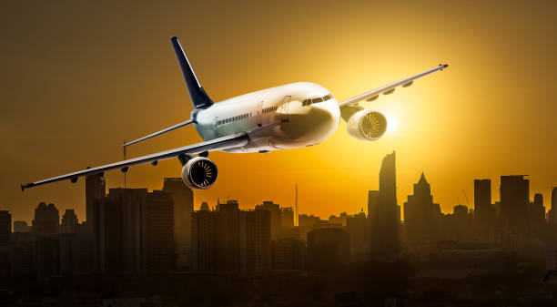 istock Airplane over city 695186640