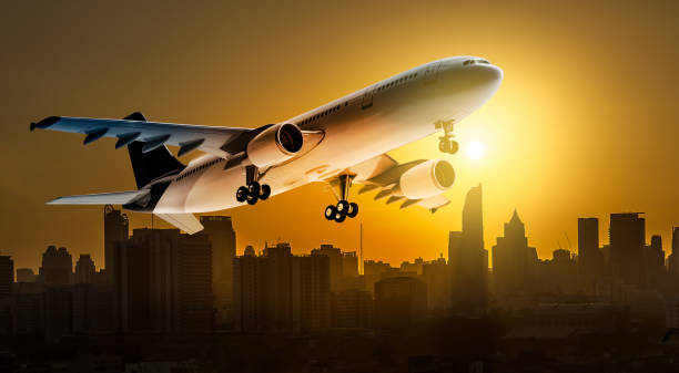 istock Airplane over city 695186916