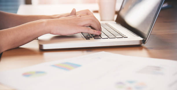 istock Close up woman hands using laptop for her work at the office. 695199000