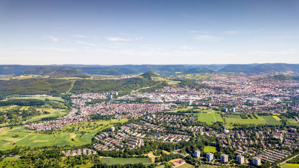 Aerial View over Reutlingen Swabian Alb Germany Aerial view over the north of the city of Reutlingen with Mount Achalm and the Swabian Alb Mountain Range in the Background. Panoramic Aerial Drone Shot. South West Germany, Baden Württemberg, Germany. stuttgart photos stock pictures, royalty-free photos & images