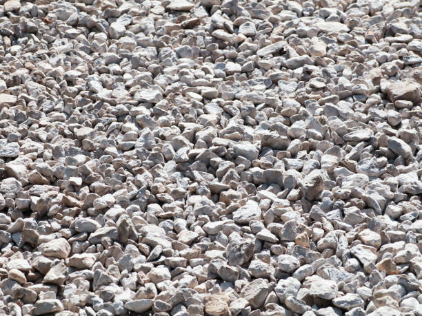 istock Gravel on a country road. Textured background 695216202