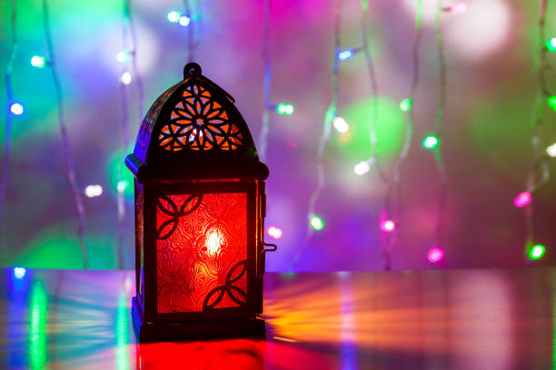 istock Arabic Lantern illuminated in colorful background 695221944