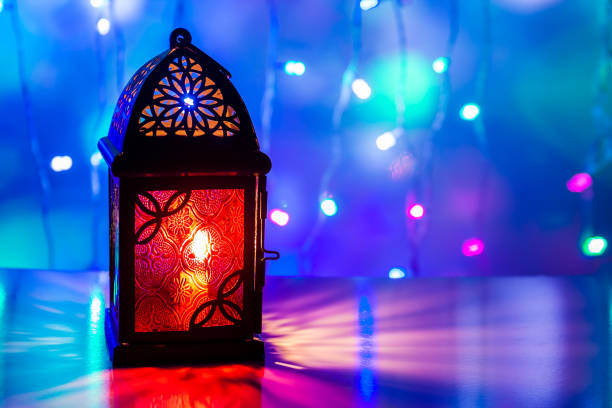 istock Arabic Lantern illuminated in colorful background 695222168
