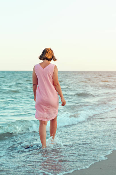istock girl on the beach 695224602