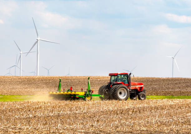 12 MAY 2009:  A farmer in a tractor pulls his planter over a no till field to plant his crops for the season.