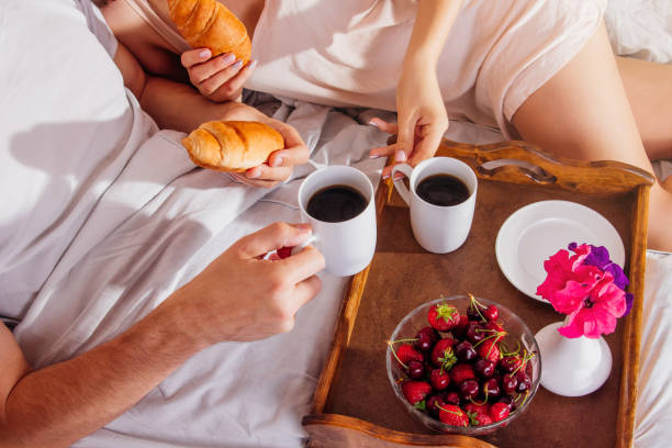 istock Couple having breakfast in bed 695231544