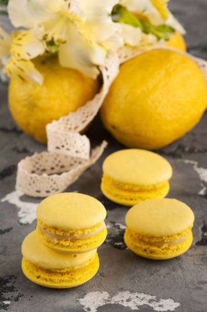 istock Yellow macaroons with lemons in background 695236644