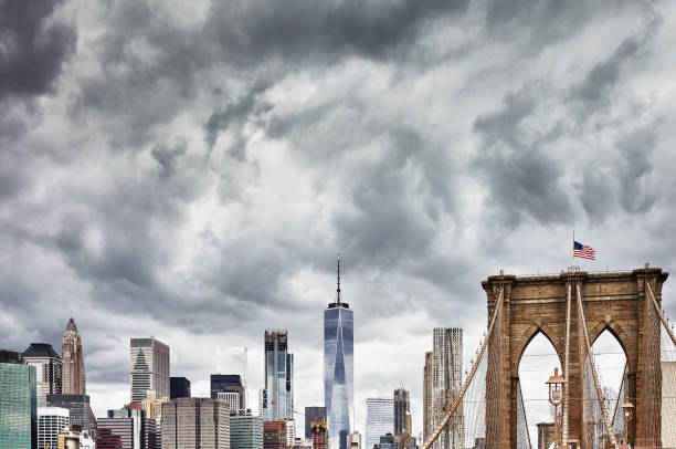 istock Stormy clouds over Manhattan and Brooklyn Bridge, NYC. 695240768