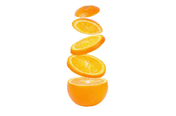 istock Falling slices of orange in air 695243650