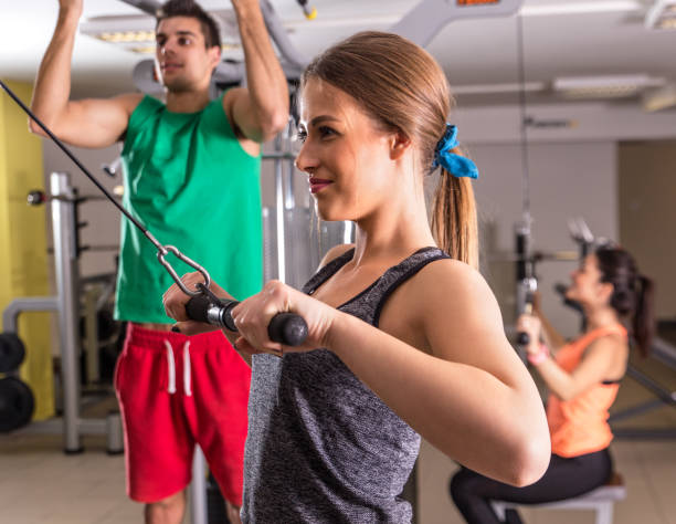 istock Group of young people exercising at gym. 695246230