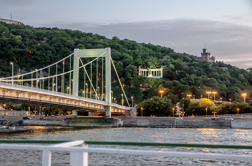Erzsebet bridge seen from cruise ship on Danube River at dawn in summer