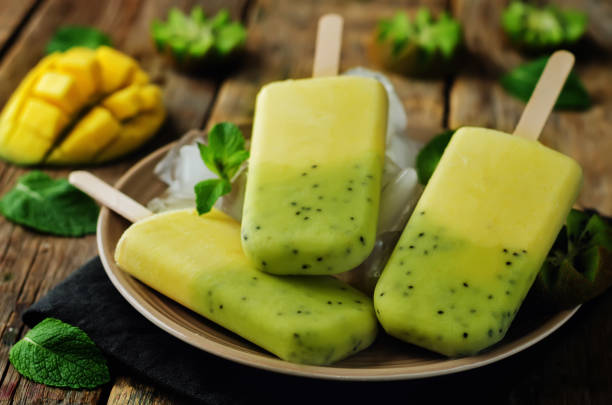 istock Kiwi mango ice cream with fruits and ices 695250246
