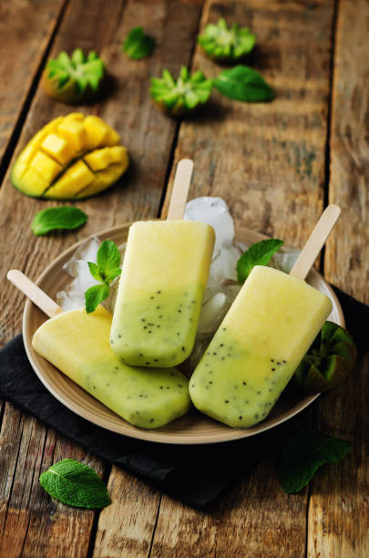 istock Kiwi mango ice cream with fruits and ices 695250248