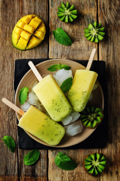 istock Kiwi mango ice cream with fruits and ices 695250252