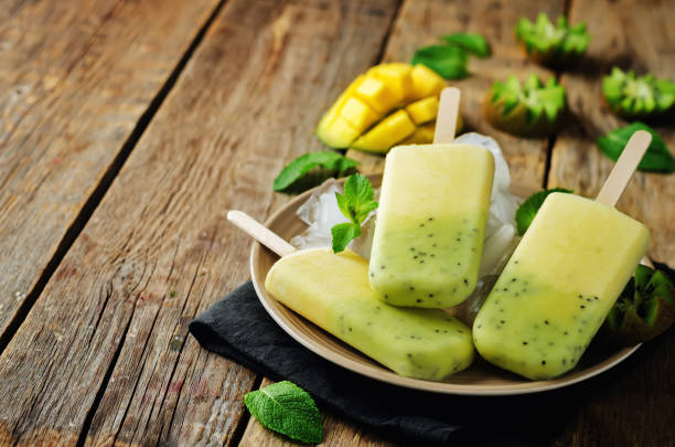 istock Kiwi mango ice cream with fruits and ices 695250254