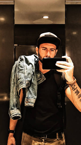 istock man take a selfie on the mirror 695250578
