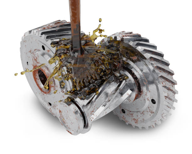 istock Cogwheels and pouring motor oil 695252780