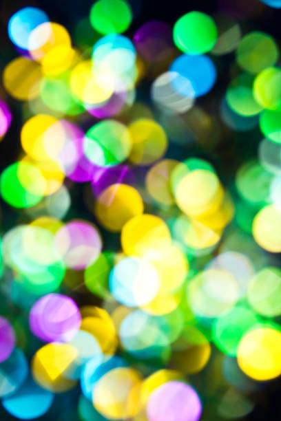 istock Glitter Bokeh Confetti On Black Background 695252994