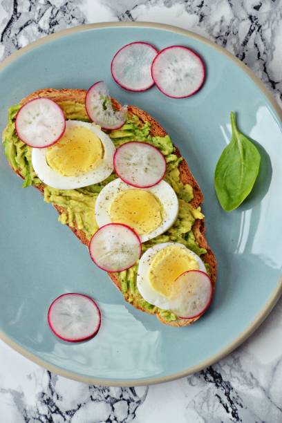 istock Toast with avocado, egg and radish 695256048