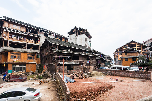 Chengyang: people near construction place in Chengyang village of Sanjiang Dong Autonomous County in spring. Chengyang includes eight villages of the Dong people
