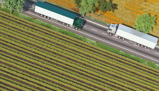 3d rendering image of trucks on the road surrounded by fields