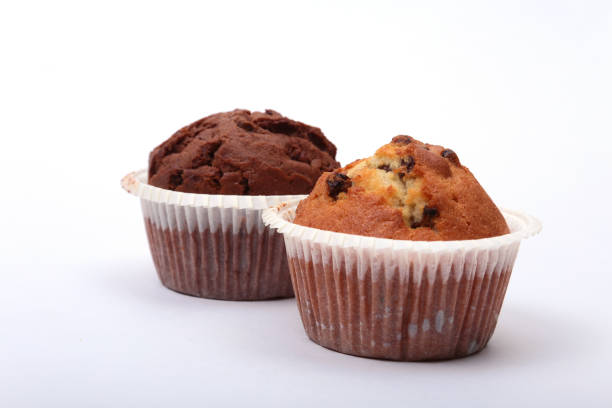 istock Fresh homemade muffins on white background. Top view. 695270664