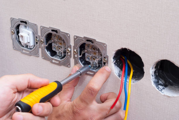 istock electrician connects the sockets 695273298