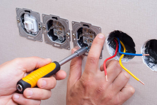 istock electrician connects the sockets 695273422
