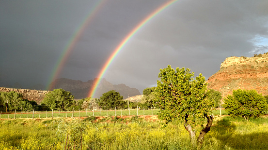 Double rainbow over Virgin River Valley farmland in Rockville Utah