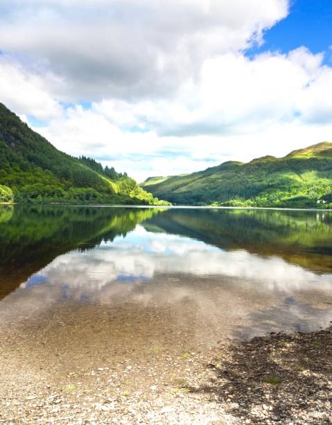 istock Beautiful Lake On Dramatic Sky In Scotland , UK 695287812