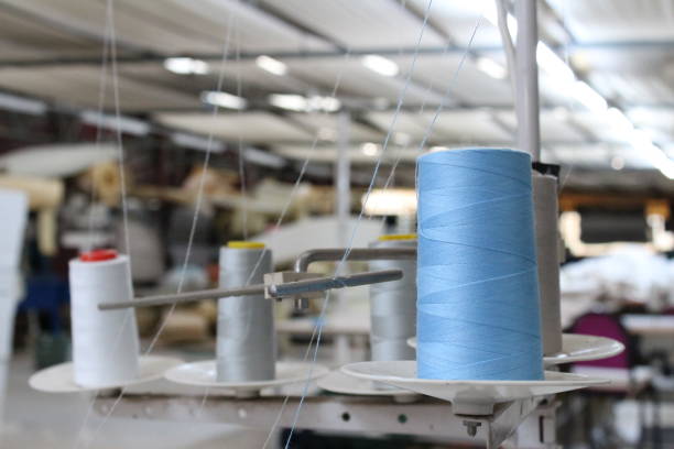 istock Reels of threads in sewing shop 695290328