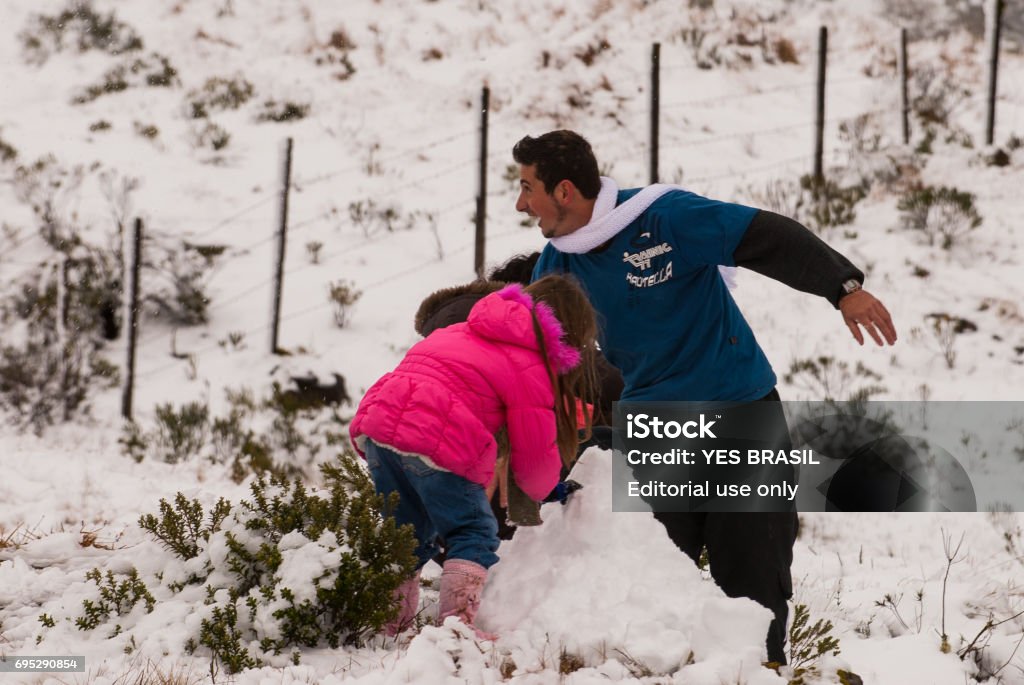 The excitement of tourists when seeing snow in Urubici, Santa Catarina, Brazil Urubici, Santa  Catarina, Brazil - August 05, 2010: Adult Stock Photo