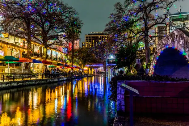 Night Time Scenic Views of the Riverwalk with Christmas Lights on a Rainy Day at San Antonio, Texas.