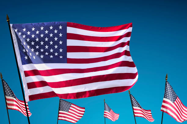 istock American Flag hanging on the pole flutter 695315970