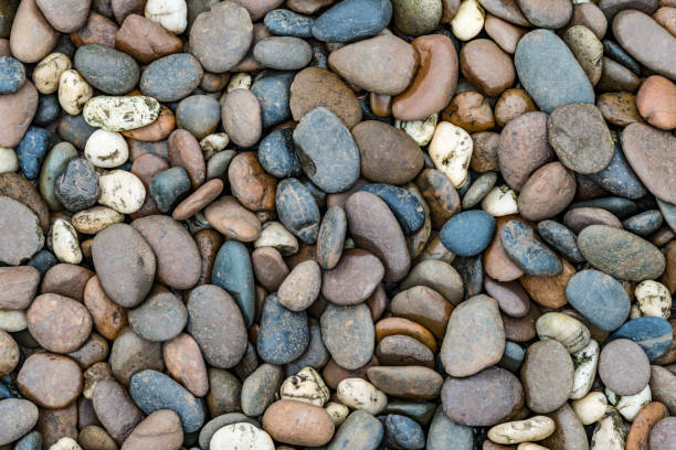 istock Brown and black gravel texture 695324508