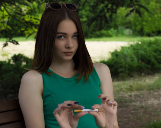 istock Young cute woman, stop smoking 695325130