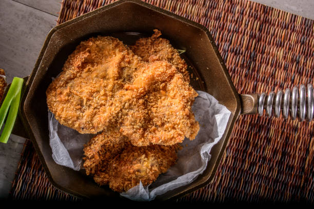 istock Panko Crusted Crispy Pork Cutlets over Steamed Rice 695325566