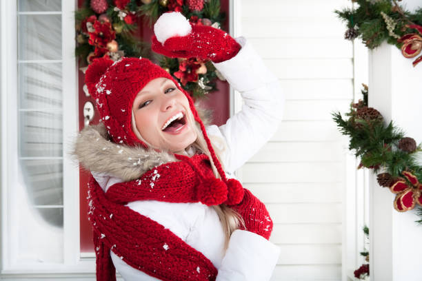 istock Smiling woman celebrating Christmas 695325600