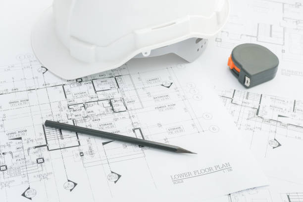 istock Architects workplace - architectural tools, blueprints, helmet, measuring tape, Construction concept. Engineering tools. Top view 695328210