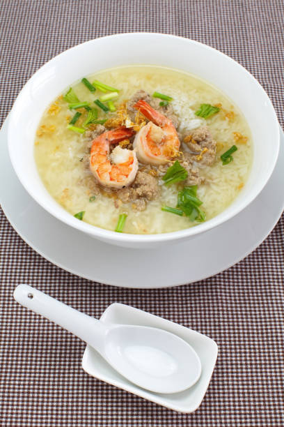 istock Rice soup bowl with shrimp and pork 695331128