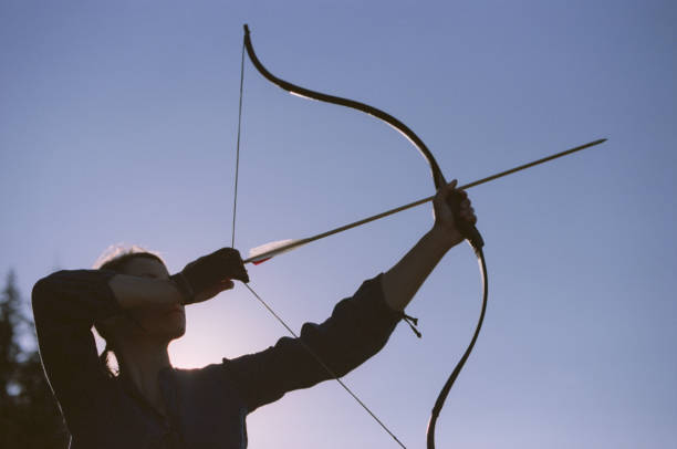 istock Archer shooting with a bow in the mountains. 695331556